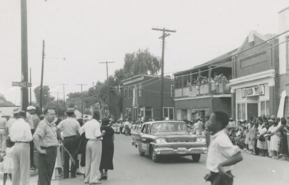 Historic Fourth of July parade in Phoebus, Hampton, Virginia, in 1959, with families lining the streets to celebrate Independence Day together.
