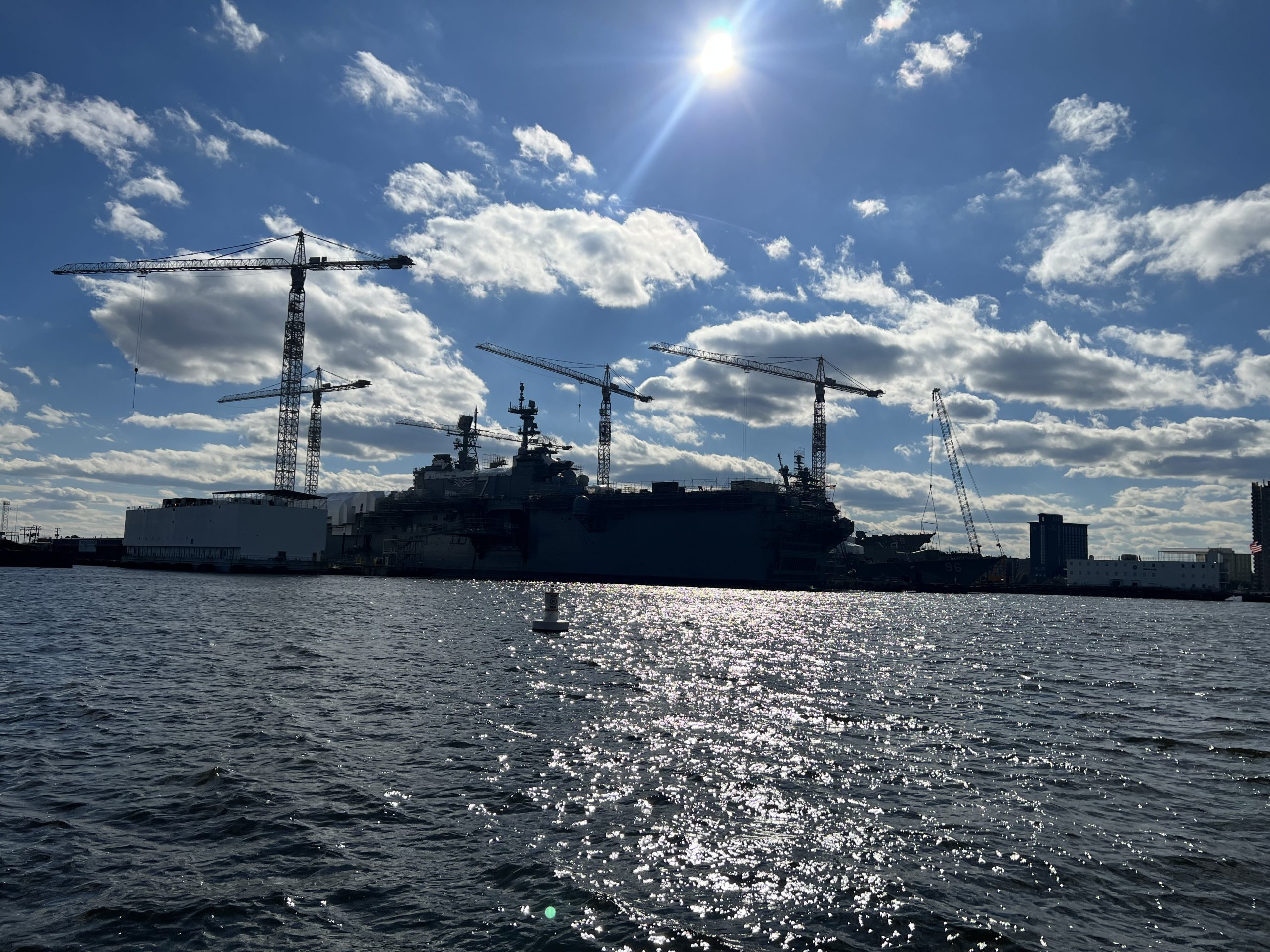 Shipyard cranes and waterfront along Hampton Roads, Virginia